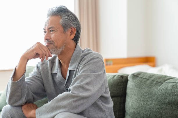 istock elderly man in night clothes in bed,fatigue 1359904616