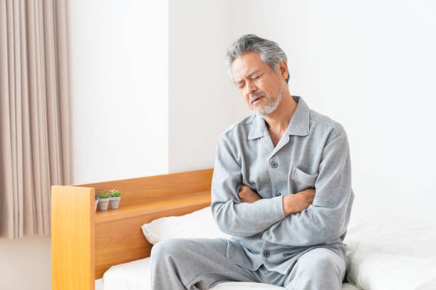 istock elderly man in night clothes in bed,fatigue 1359904704