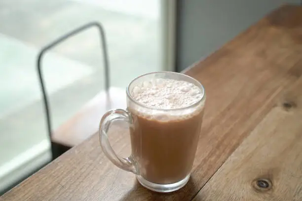 Photo of Milk tea on wood table.