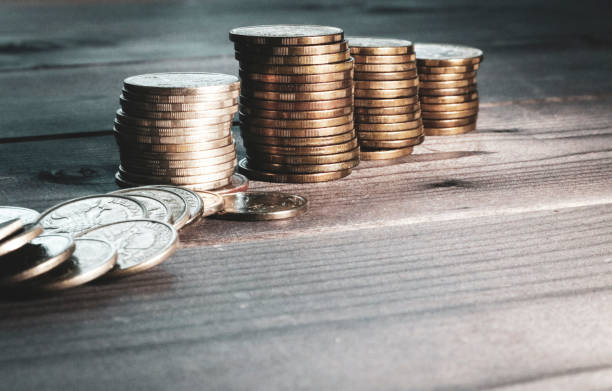 istock A stack of coins on a dark wooden surface. Copy space. Russian metallic rubles. 1359908752
