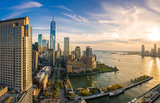 Aerial view of Lower Manhattan skyline at sunset viewed from above West Street in Tribeca neighborhood.