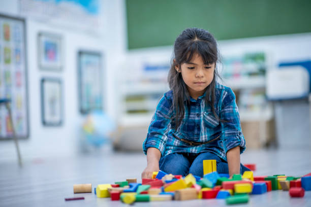 istock Making a Tower out of Blocks 1359910648