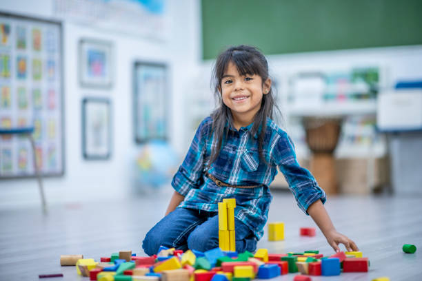 istock Making a Tower out of Blocks 1359910662