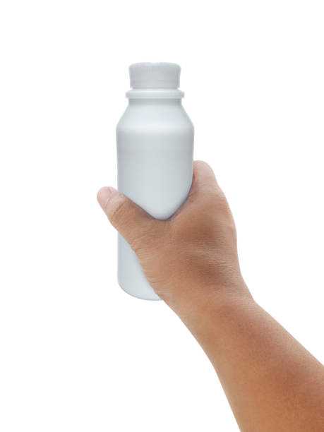 istock hand holding milk bottle isolated on white background 1359912895