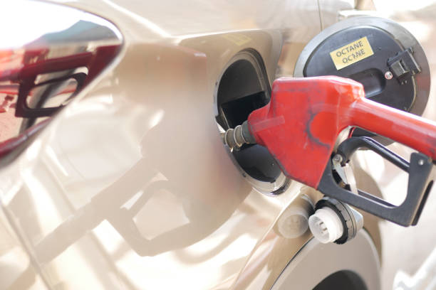 istock car refueling at the gas station, 1359914489