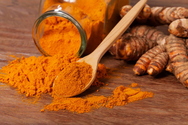 istock Fresh organic root and turmeric powder - Curcuma longa 1359914567