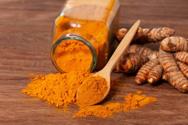 istock Fresh organic root and turmeric powder - Curcuma longa 1359914588
