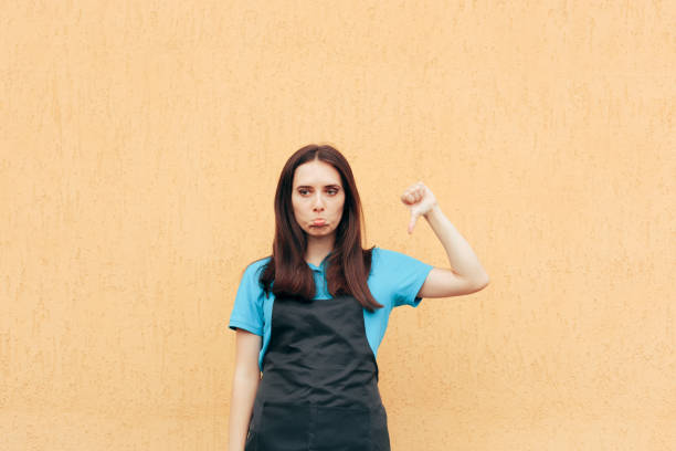 istock Unhappy Employee Holding Thumbs Down Protesting 1359915261