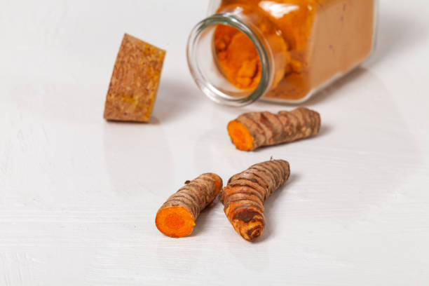 istock Fresh organic root and turmeric powder - Curcuma longa 1359915366