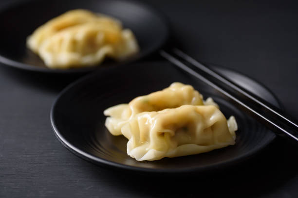 istock Wonton stuffed, gyoza or dumplings 1359916209