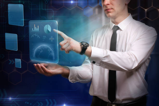 istock Business, technology, internet and networking concepts. Young businessman working on virtual tablet 1359916900