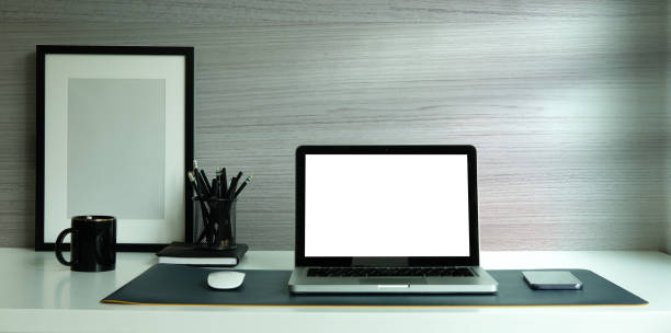istock Laptop computer, digital tablet and houseplant on white table. 1359917594