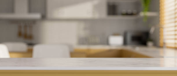istock Copy space on kitchen counter table top in cozy Scandinavian kitchen interior 1359918414