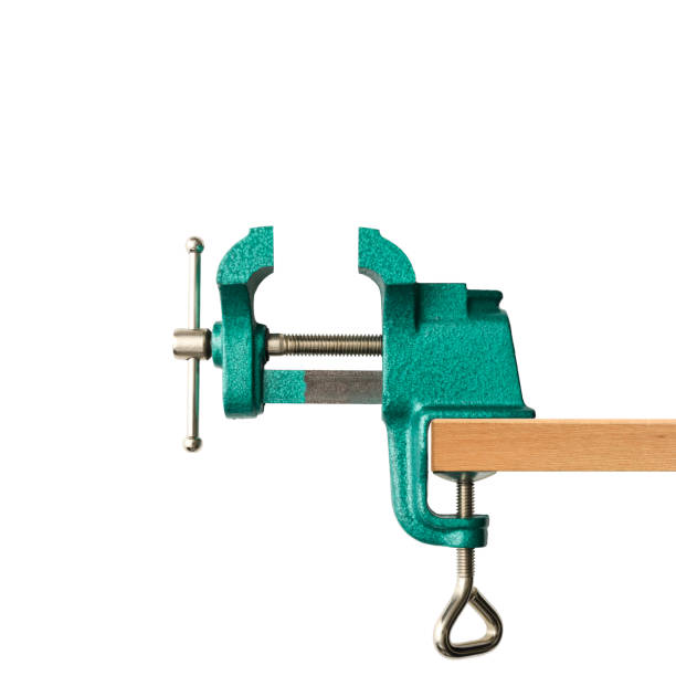 Side view of opend green table vice iagainst on white background.