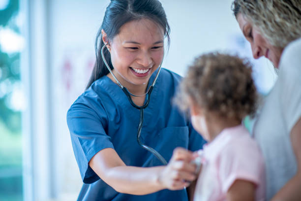 istock Mother and Daughter at the Doctors 1359923504