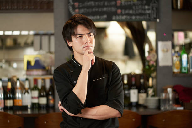 istock Asian man worried at a restaurant 1359923541
