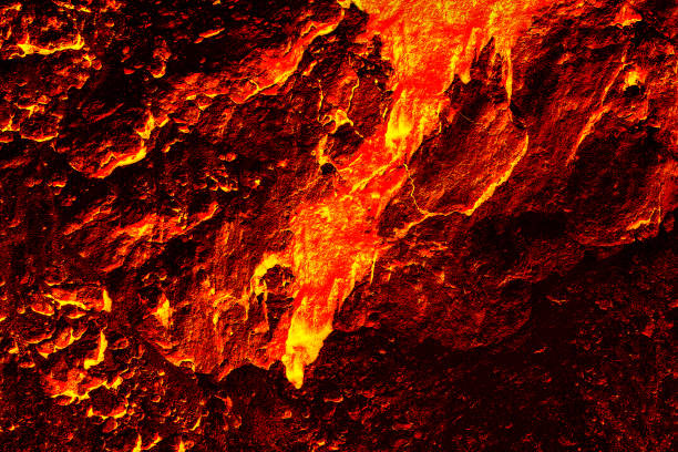 Molten liquid lava flows down the surface of the volcano. Texture and pattern of magma.