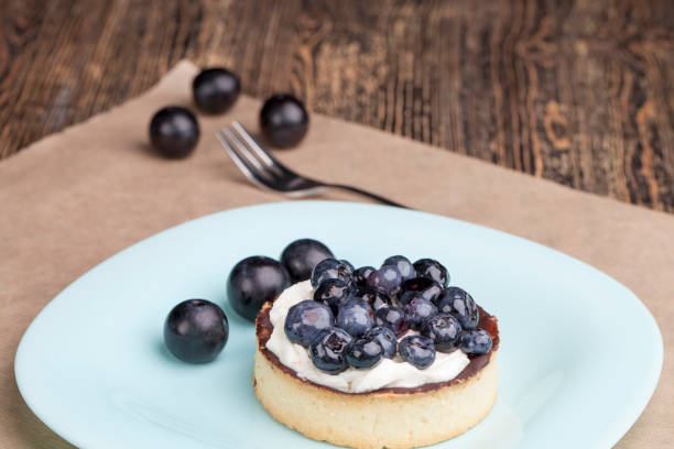 istock tartlet with chocolate and buttercream with blueberries 1359924543