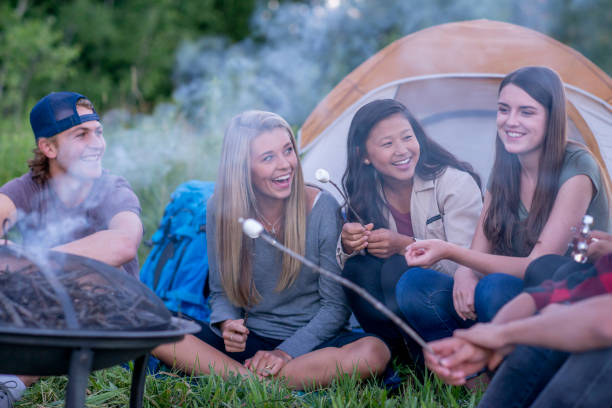 istock Teens Hanging Out Around the Fire 1359925542