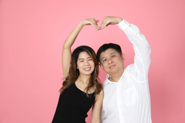 istock Pink Asian Couple 1359928575