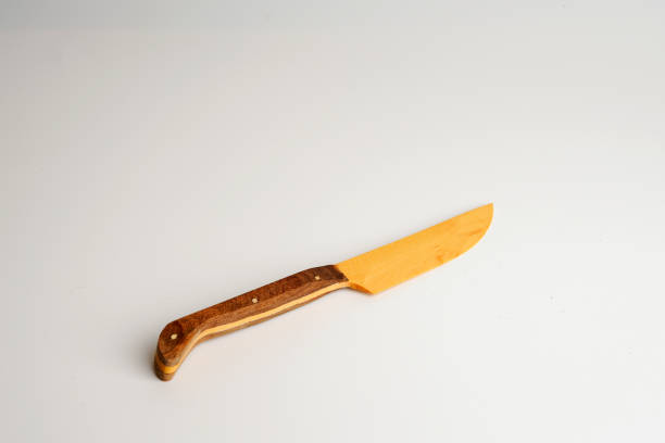 istock Wooden knife isolated on white background with clipping path. Above view. 1359932813