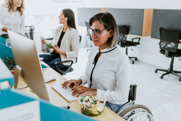 transgender latin woman working with computer at the office in Mexico Latin America transgender latin woman working with computer at the office in Mexico Latin America transgender person in office stock pictures, royalty-free photos & images