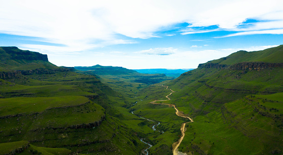 Drakensberg mountains at the border with Lesotho, South Africa. Rural scenery showing the spectacular landscape with Sani Pass of South Africa. Drone photography. Tourism and vacations concept.