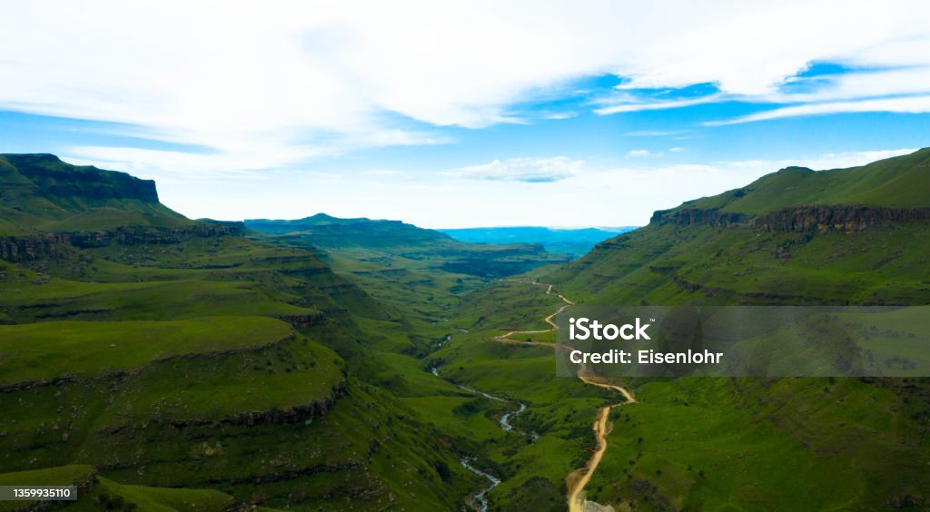 Aerial view of the beautiful mountain valley in the northern Drakensberg, South Africa. Drakensberg mountains at the border with Lesotho, South Africa. Rural scenery showing the spectacular landscape with Sani Pass of South Africa. Drone photography. Tourism and vacations concept. Kwazulu-Natal Stock Photo