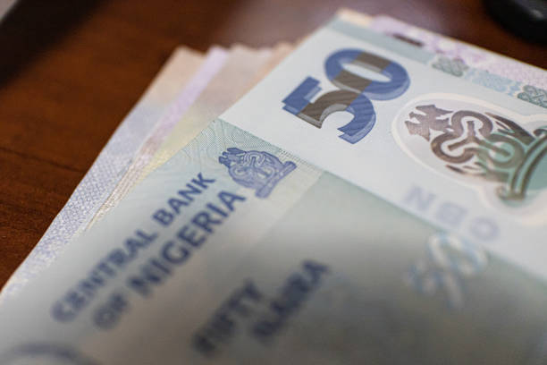 istock Nigerian 50 Naira note closeup in bank 1359935762