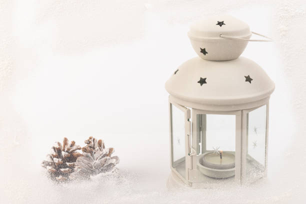istock White lantern with candle inside and Christmas decoration on white background. Copy space. 1359938879