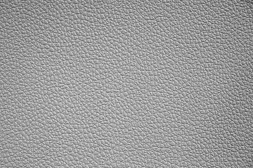 Leather, plastic imitation with the texture of genuine leather. Close-up.