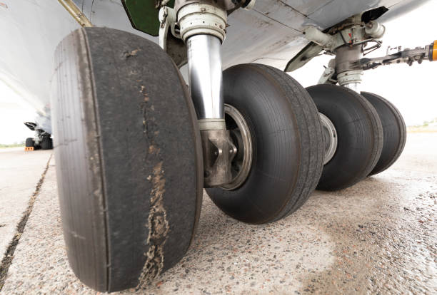 Worn cargo plane chassis. Damaged rubber tire as a result of prolonged use.