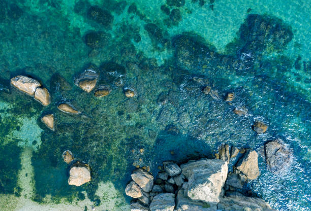 istock Clear water on the beach with rocks, aerial view. 1359944892