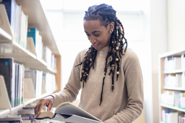 istock Young woman in the Library 1359945888