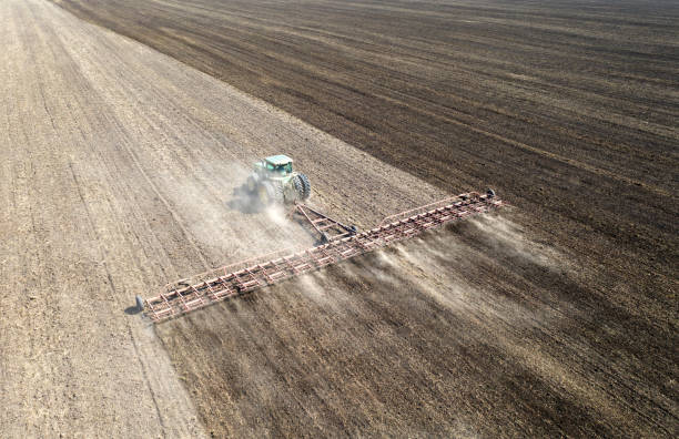 istock The tractor cultivates the soil view from the drone 1359945907
