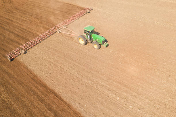 istock The tractor cultivates the soil view from the drone 1359945915