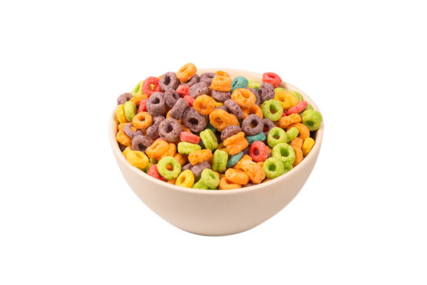 istock Colorful rings cereal spill out into a bowl. Breakfast. Isolated. 1359950696