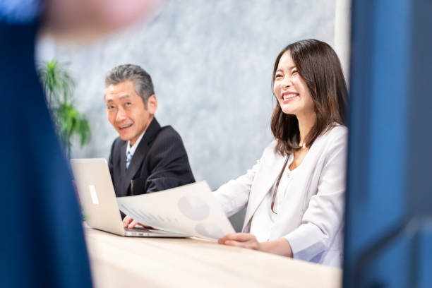 istock President and secretary having a meeting with a client 1359951919