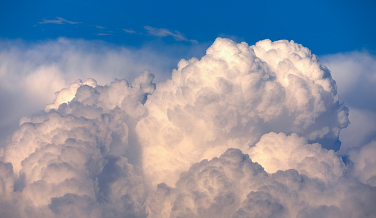 Storm clouds in the summer blue sky. Natural abstract background.