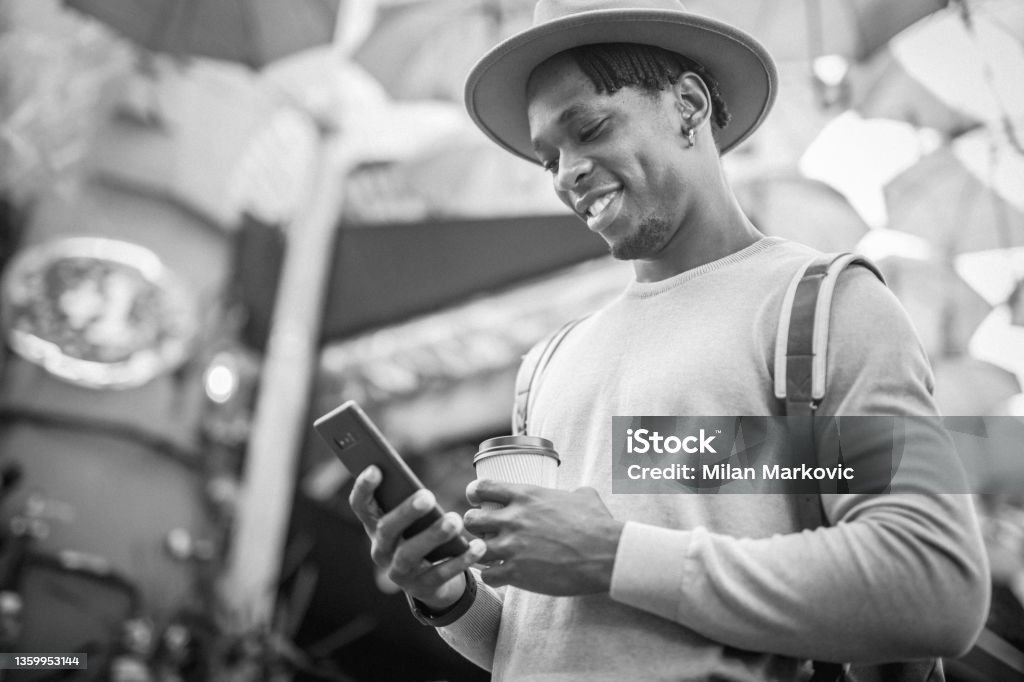 A young black man walks the streets of Istanbul, touring a big city Black and white photography. A young black man, a young black man walks the streets of Istanbul, a tourist who tours major cities and uses it for his blog. 20-24 Years Stock Photo