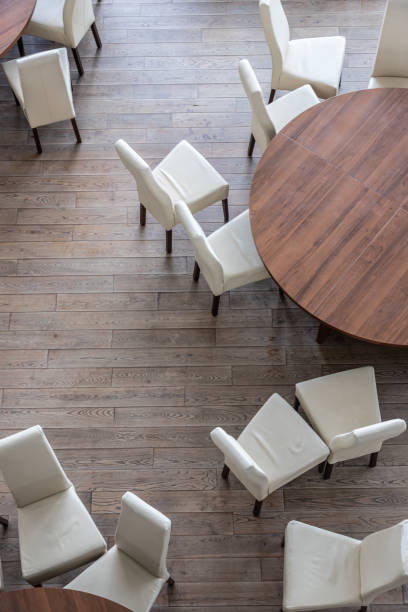 istock Abstract modern interior of cafe or meeting room with rounded armchairs 1359953736