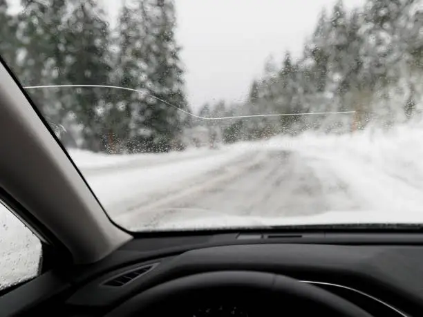 Photo of Car Windshield with Large Crack POV Winter Driving