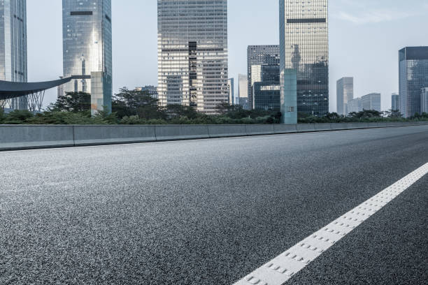 istock Asphalt road and commercial building landscape 1359954903