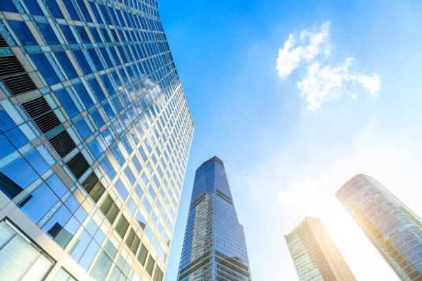 istock Modern office building with glass facade on a clear sky background 1359955979