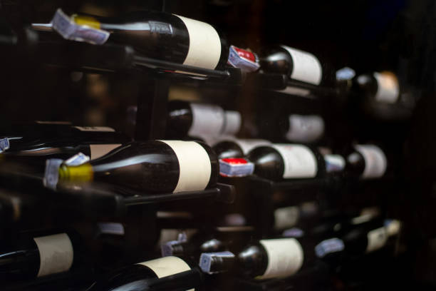 istock a lot of red wine bottles on rack keep in wine cellar in basement 1359956636
