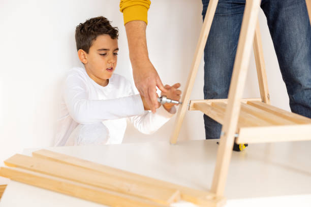 istock Father and son assembling made furniture 1359962874
