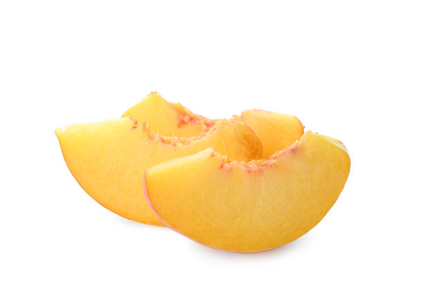 istock Slices of ripe peach on white background 1359962910