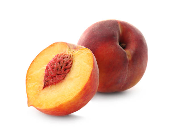 istock Whole and cut ripe peaches isolated on white 1359962932
