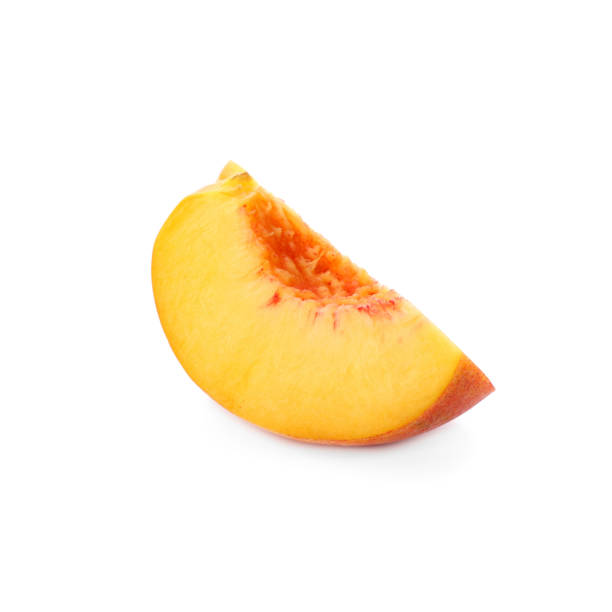 istock Slice of ripe peach isolated on white 1359962933