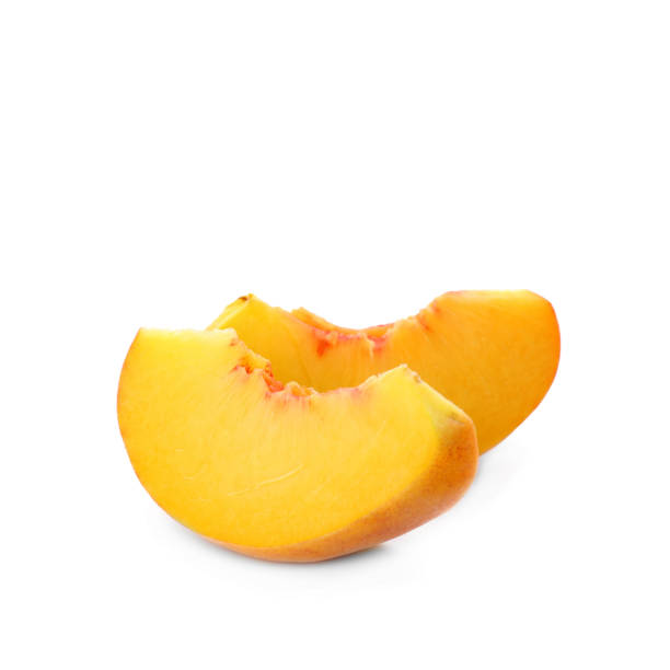 istock Slices of ripe peach on white background 1359962999